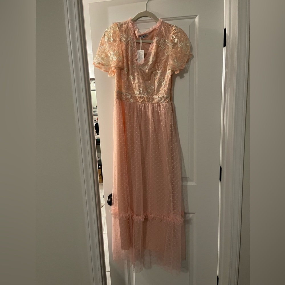 Peach colored spring dress new with tags. Goes to ankle